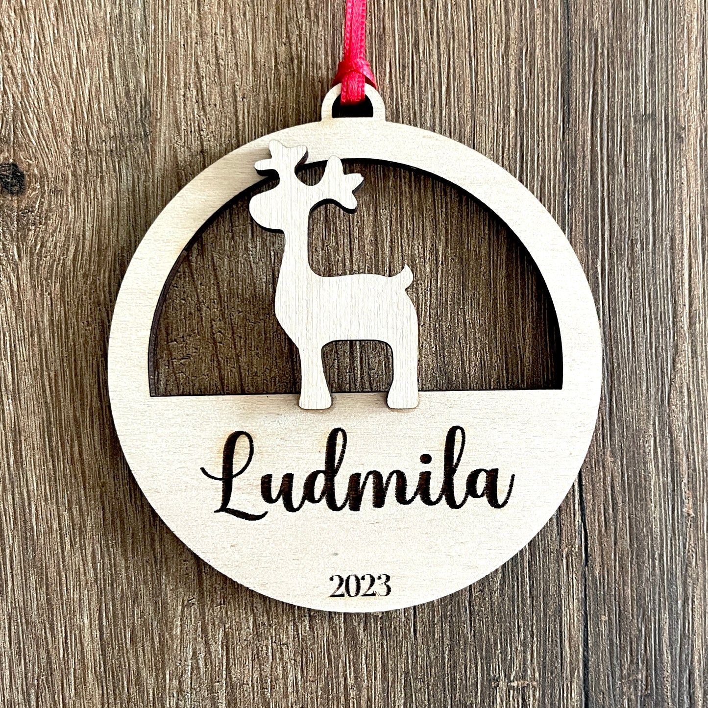 Customizable wooden Christmas ball with reindeer pattern and first name